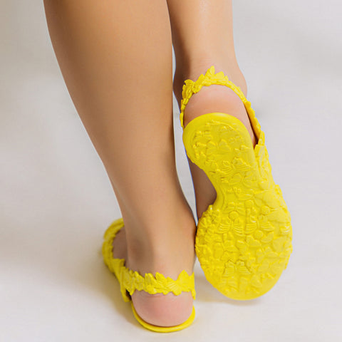 Girl wearing yellow summer sandals